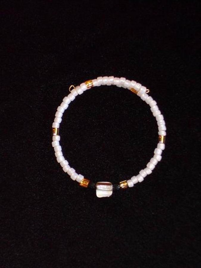 Iridescent blush and amber glass beads with mother of pearl and onyx accent beads. Gold memory wire.  (C120P119) - Click for more details