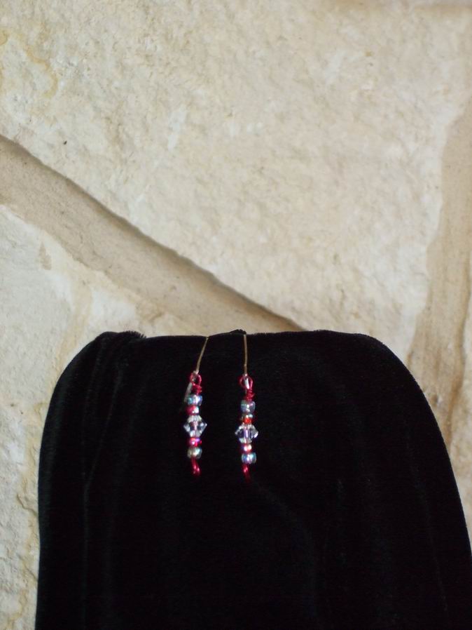 Swarovski Crystals with red and clear glass beads on red wire and sterling silver ear wires.  (C120P162) - Click for more details