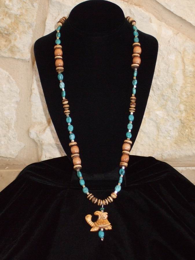 Turquoise, sterling silver and wood beads with carved turtle pendant. Silver clasp.  (C120P167) - Click for more details