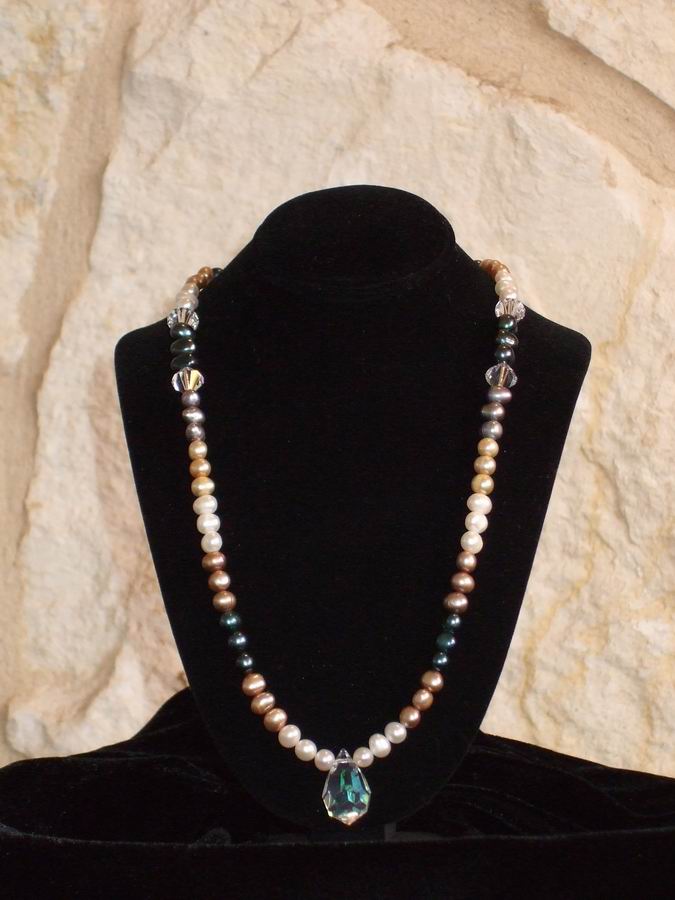 Freshwater pearls and Swarovski Crystals with silver clasp.  (C120P172) - Click for more details