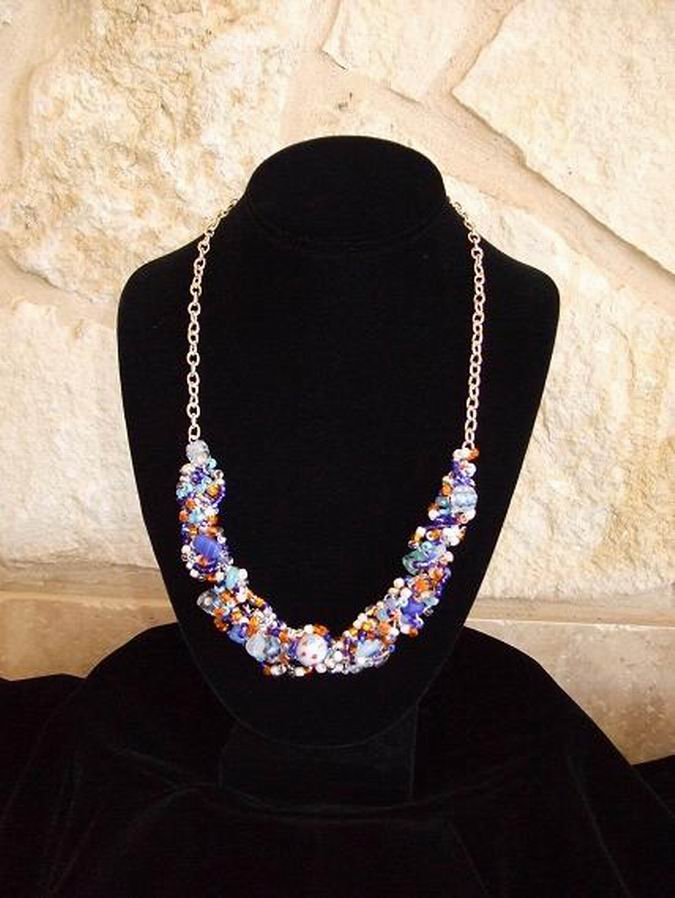 Sterling Silver, Blue, Orange, Aqua, and white beads accented by several hand-blown beads.  (C120P70) - Click for more details